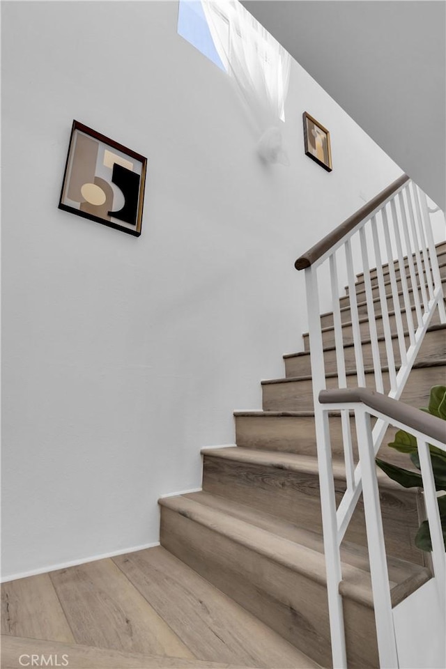 stairs with wood finished floors