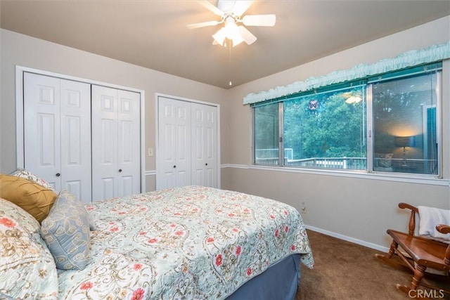 bedroom featuring multiple closets, carpet, baseboards, and a ceiling fan