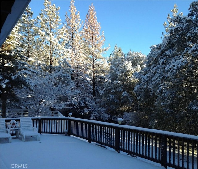 view of snow covered deck