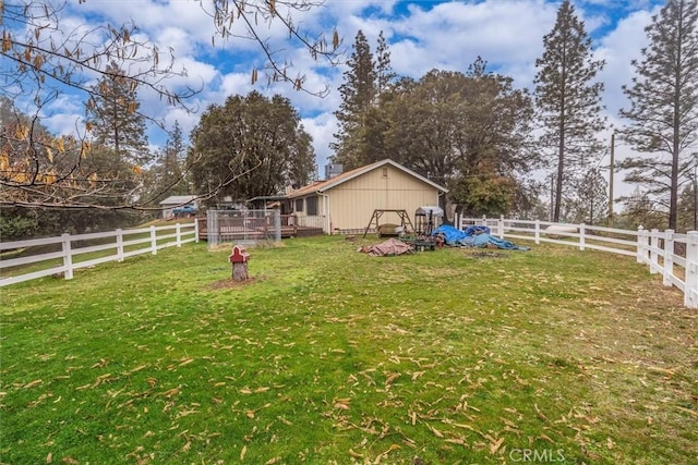 view of yard with a fenced backyard and a deck