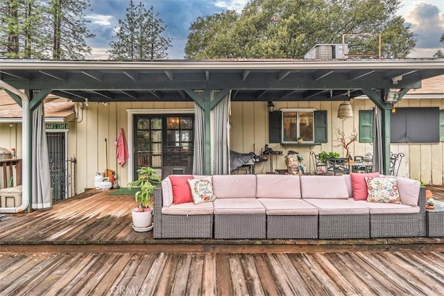 deck featuring outdoor lounge area