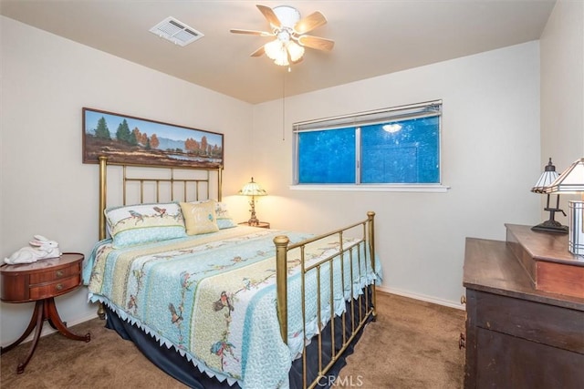 carpeted bedroom with ceiling fan, visible vents, and baseboards