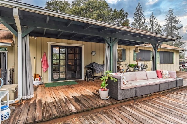 wooden deck featuring an outdoor living space