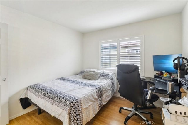 bedroom with wood finished floors