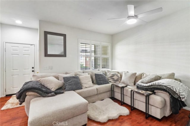 living area with a ceiling fan, wood finished floors, and recessed lighting