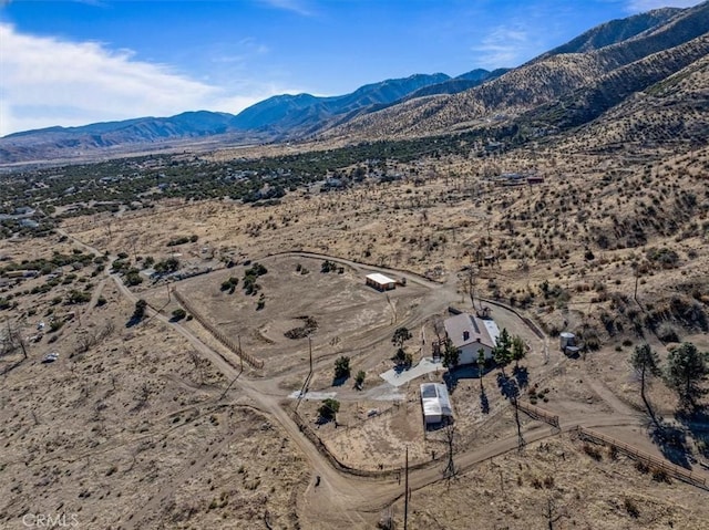 drone / aerial view with a mountain view and view of desert