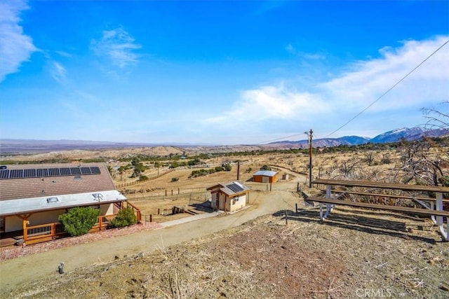 aerial view featuring a rural view and a mountain view