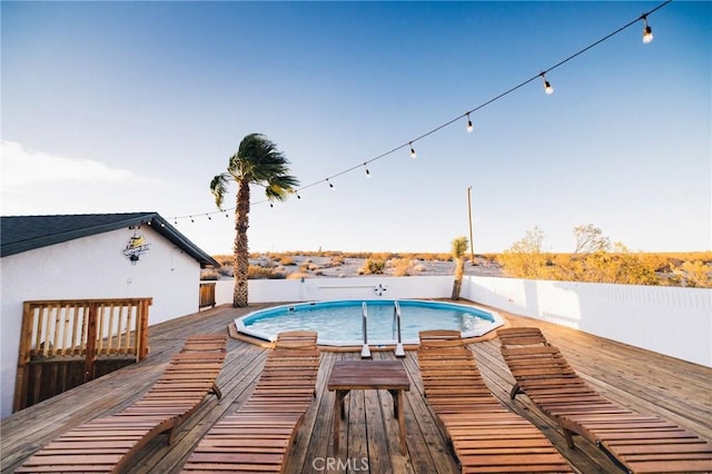 view of pool featuring a fenced in pool and a wooden deck