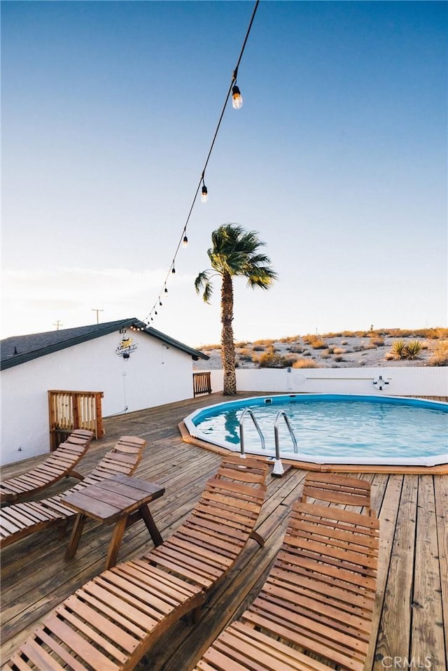 pool featuring a wooden deck