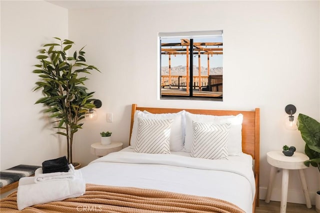 bedroom with wood finished floors