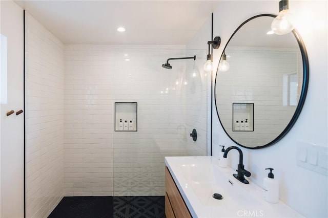 full bath featuring recessed lighting, walk in shower, and vanity