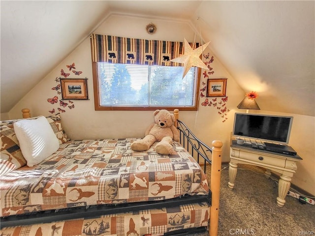 bedroom with carpet and vaulted ceiling