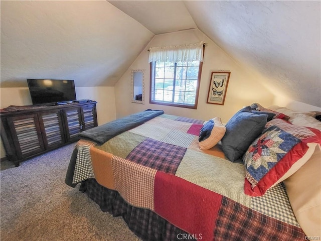 carpeted bedroom featuring vaulted ceiling