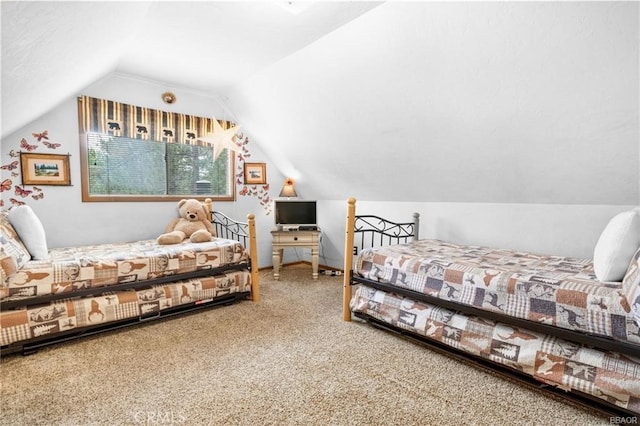 bedroom with lofted ceiling and carpet floors