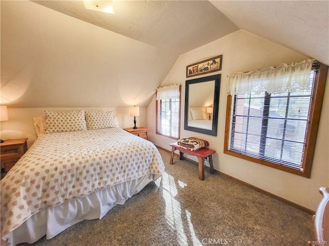 bedroom with lofted ceiling, carpet floors, and baseboards