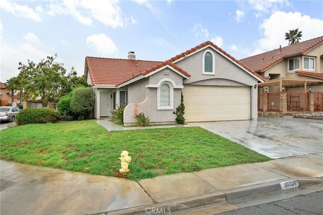 mediterranean / spanish-style home with a tile roof, a front yard, stucco siding, a chimney, and driveway