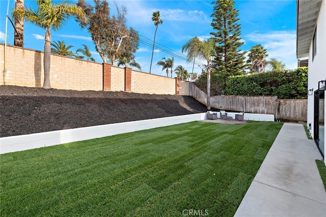 view of yard with a fenced backyard