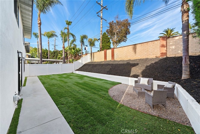 view of yard with a patio area and a fenced backyard