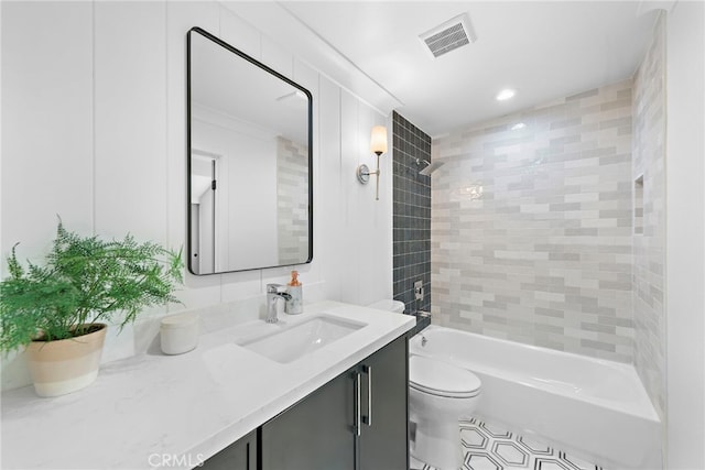 bathroom featuring visible vents, shower / tub combination, vanity, and toilet