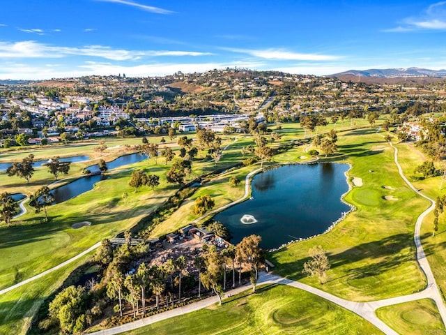 birds eye view of property with golf course view and a water and mountain view