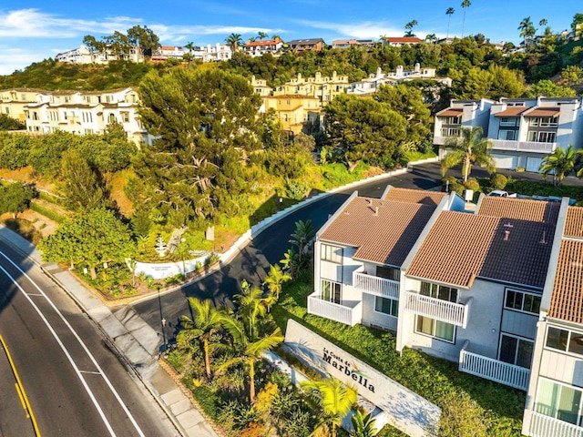 birds eye view of property with a residential view