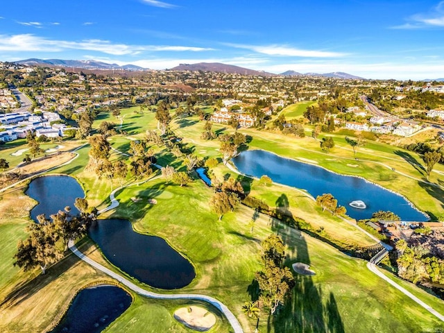 bird's eye view with golf course view and a water and mountain view