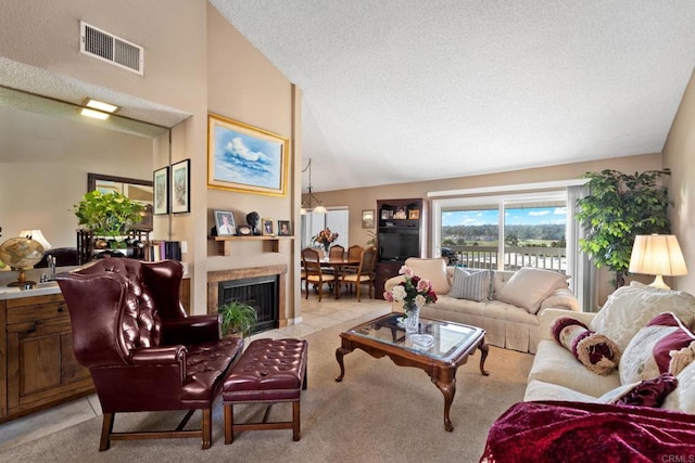 living room featuring visible vents, light colored carpet, a textured ceiling, high vaulted ceiling, and light tile patterned flooring