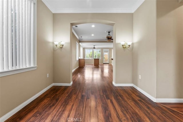 hall with baseboards, dark wood-style flooring, and crown molding