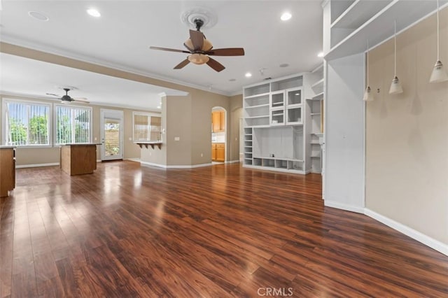 unfurnished living room featuring dark wood finished floors, a ceiling fan, and ornamental molding