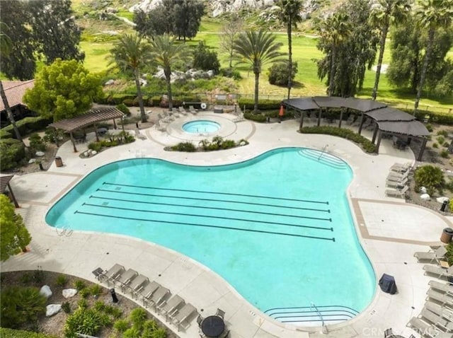 community pool featuring a community hot tub, a patio, and a pergola