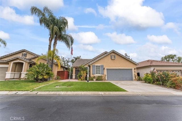 view of front of property featuring stucco siding, a front lawn, concrete driveway, and an attached garage