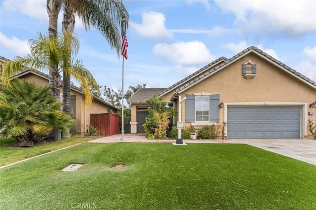 view of front facade with a garage, stucco siding, concrete driveway, and a front yard