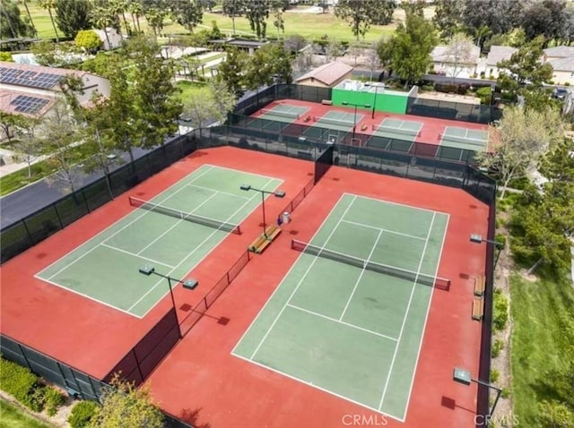 view of sport court with fence