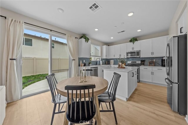 34720 Mustang Ln, Fallbrook, CA 92028 - dining area with light wood-style flooring and recessed lighting