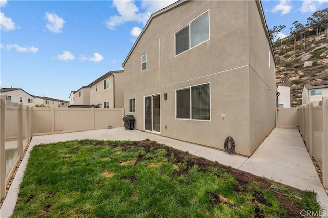 34720 Mustang Ln, Fallbrook, CA 92028 - back of house with a patio area, stucco siding, and a fenced backyard