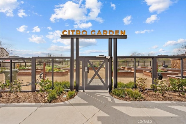 view of property's community with a gate and fence