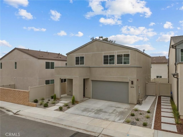 34720 Mustang Ln, Fallbrook, CA 92028 - view of front facade featuring an attached garage, concrete driveway, stucco siding, and a gate