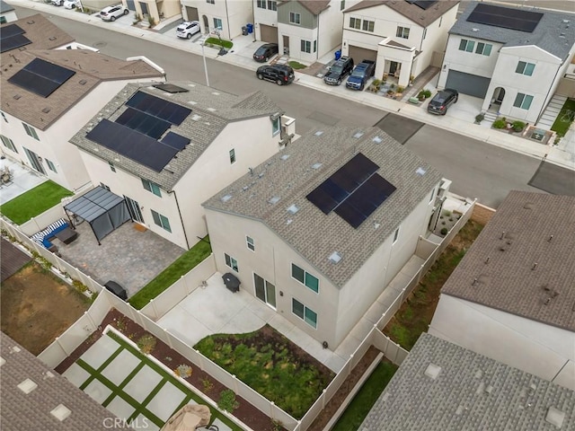 birds eye view of property with a residential view