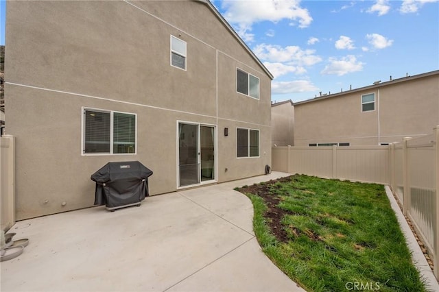 34720 Mustang Ln, Fallbrook, CA 92028 - back of property featuring a fenced backyard, stucco siding, and a patio