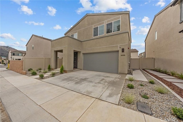 34720 Mustang Ln, Fallbrook, CA 92028 - view of front of property with concrete driveway, stucco siding, an attached garage, and a gate