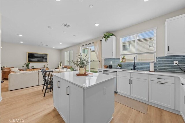 34720 Mustang Ln, Fallbrook, CA 92028 - kitchen featuring stainless steel dishwasher, a kitchen island, backsplash, light wood-type flooring, and recessed lighting