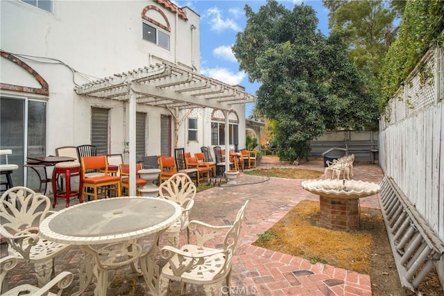 view of patio / terrace featuring fence and a pergola