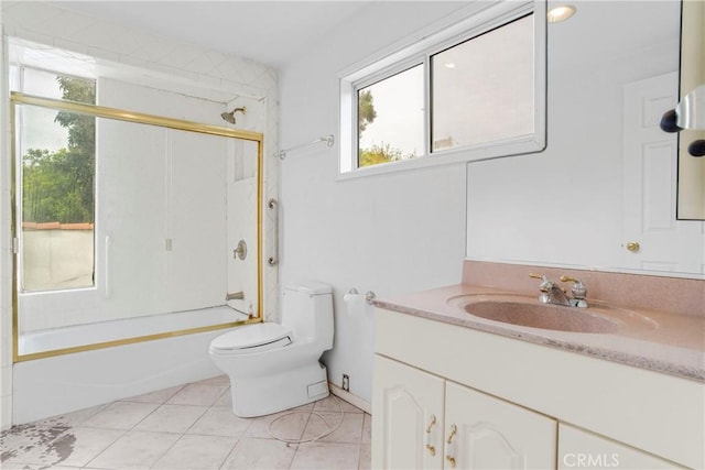 full bathroom featuring tile patterned flooring, toilet, vanity, and bathtub / shower combination