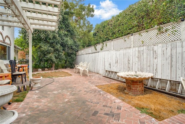 view of patio featuring fence