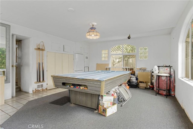 rec room with light tile patterned flooring and a healthy amount of sunlight