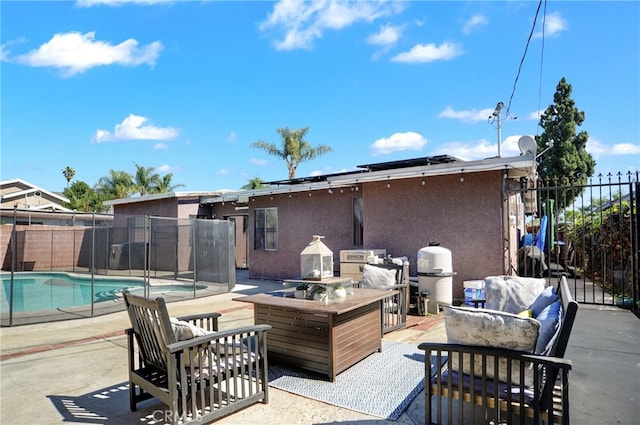 view of patio / terrace featuring a fenced in pool, a grill, and fence