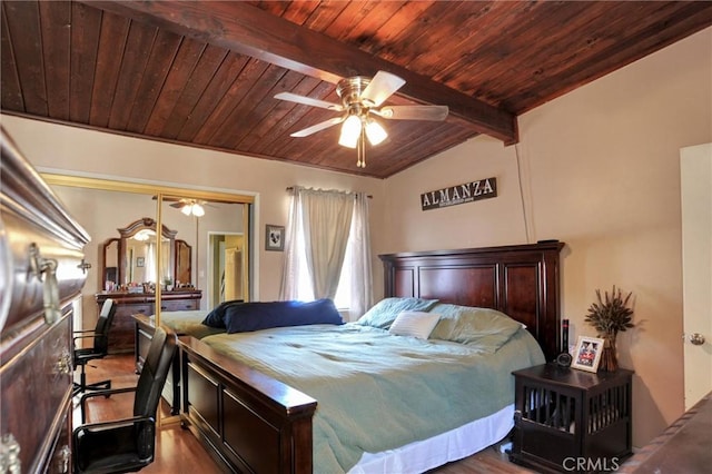 bedroom featuring wood ceiling, a closet, beam ceiling, and wood finished floors