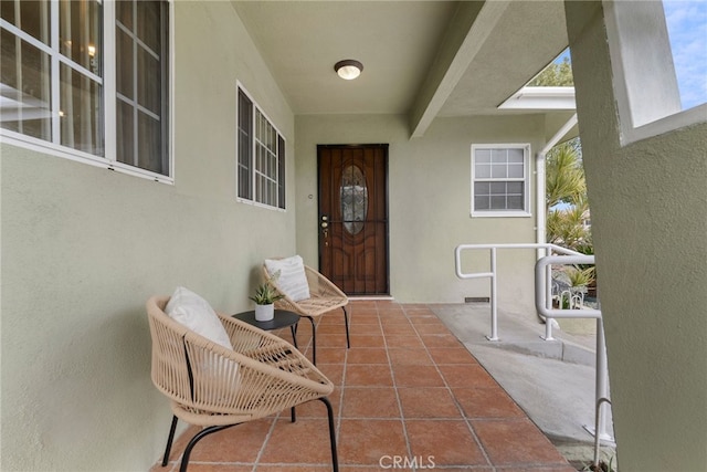 property entrance featuring stucco siding