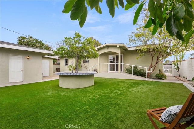 view of yard featuring a gate, fence, and a patio