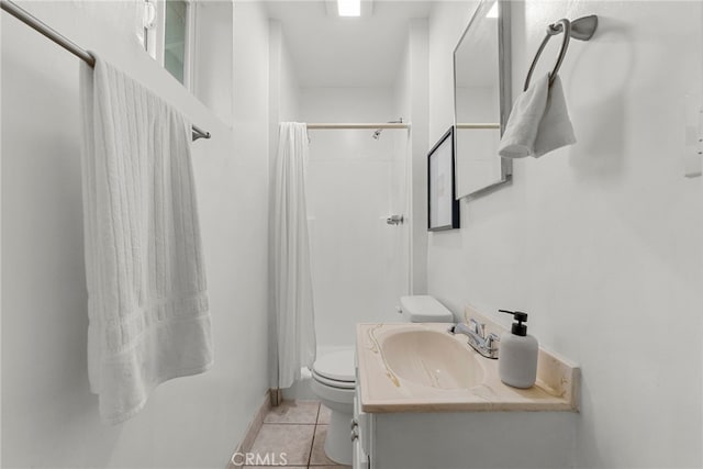 full bathroom with curtained shower, vanity, toilet, and tile patterned floors